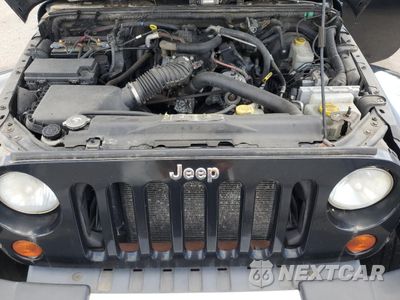 Zdjęcie 12 z 13 samochodu: 2011 JEEP WRANGLER UNLIMITED SAHARA VIN:1J4HA5H19BL633246 - miniatura