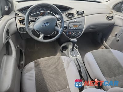 Zdjęcie 8 z 14 samochodu: 2004 FORD FOCUS LX VIN:1FAFP33P84W191529 - miniatura