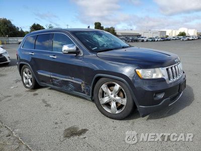 Czwarte zdjęcie samochodu z boku: 2013 JEEP GRAND CHEROKEE OVERLAND VIN:1C4RJFCT6DC531933 - miniatura