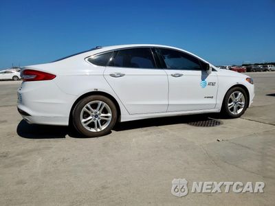 Trzecie zdjęcie samochodu z tyłu: 2018 FORD FUSION SE HYBRID VIN:3FA6P0LU7JR171646 - miniatura