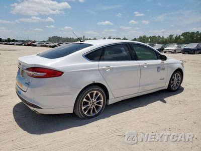 Trzecie zdjęcie samochodu z tyłu: 2017 FORD FUSION SE HYBRID VIN:3FA6P0LUXHR409032 - miniatura