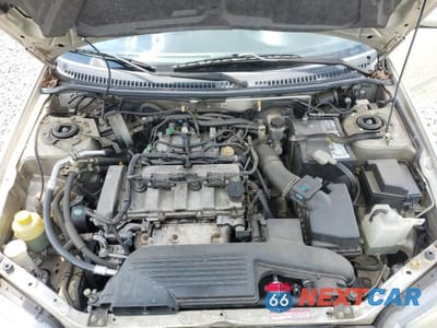 Zdjęcie 11 z 12 samochodu: 2002 MAZDA PROTEGE DX VIN:JM1BJ226720635058 - miniatura