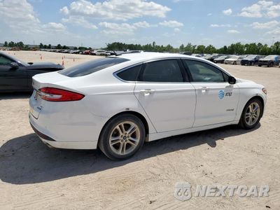 Trzecie zdjęcie samochodu z tyłu: 2018 FORD FUSION SE HYBRID VIN:3FA6P0LU0JR171634 - miniatura