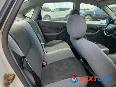 Zdjęcie 10 z 14 samochodu: 2004 FORD FOCUS LX VIN:1FAFP33P84W191529 - miniatura