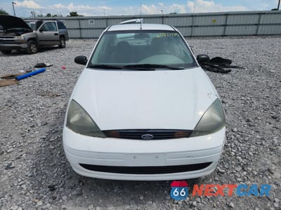 Piąte zdjęcie samochodu w środku: 2004 FORD FOCUS LX VIN:1FAFP33P84W191529 - miniatura