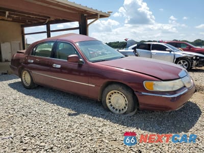 Czwarte zdjęcie samochodu z boku: 2000 LINCOLN TOWN CAR EXECUTIVE VIN:1LNHM81W6YY774724 - miniatura