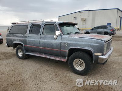 Czwarte zdjęcie samochodu z boku: 1987 CHEVROLET SUBURBAN V10 VIN:1GNEV16K5HF122312 - miniatura