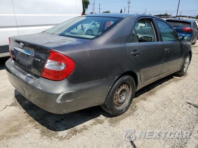 Trzecie zdjęcie samochodu z tyłu: 2003 TOYOTA CAMRY LE VIN:JTDBE32KX30215061 - miniatura