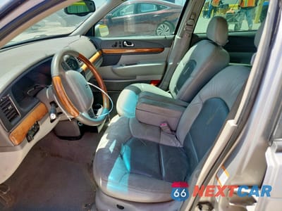 Zdjęcie 7 z 14 samochodu: 2002 LINCOLN CONTINENTAL VIN:1LNHM97V72Y693131 - miniatura
