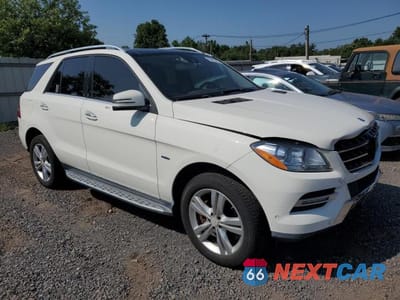Czwarte zdjęcie samochodu z boku: 2012 MERCEDES-BENZ ML 350 BLUETEC VIN:4JGDA2EB6CA044759 - miniatura