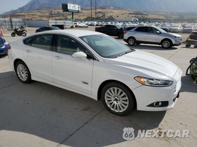 Czwarte zdjęcie samochodu z boku: 2014 FORD FUSION SE PHEV VIN:3FA6P0PU7ER397718 - miniatura