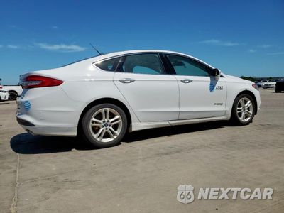 Trzecie zdjęcie samochodu z tyłu: 2018 FORD FUSION SE HYBRID VIN:3FA6P0LU7JR118588 - miniatura