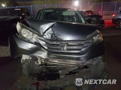 Piąte zdjęcie samochodu w środku: 2013 HONDA CR-V LX VIN:2HKRM3H32DH511407 - miniatura