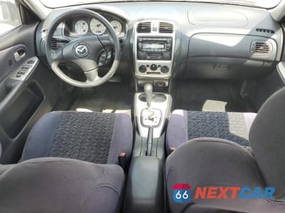 Zdjęcie 8 z 12 samochodu: 2002 MAZDA PROTEGE DX VIN:JM1BJ226720635058 - miniatura