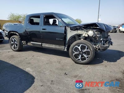 Czwarte zdjęcie samochodu z boku: 2023 RIVIAN R1T ADVENTURE VIN:7FCTGBAA5PN028055 - miniatura