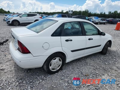 Trzecie zdjęcie samochodu z tyłu: 2004 FORD FOCUS LX VIN:1FAFP33P84W191529 - miniatura
