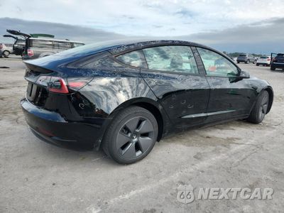 Trzecie zdjęcie samochodu z tyłu: 2023 TESLA MODEL 3 VIN:5YJ3E1EA7PF672154 - miniatura
