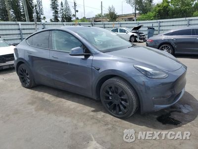 Czwarte zdjęcie samochodu z boku: 2023 TESLA MODEL Y VIN:7SAYGDEE3PF842887 - miniatura