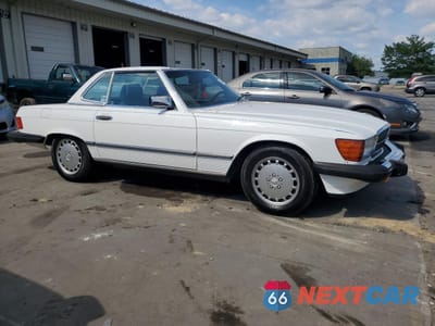 Czwarte zdjęcie samochodu z boku: 1987 MERCEDES-BENZ 560 SL VIN:WDBBA48D2HA056238 - miniatura