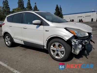 Czwarte zdjęcie samochodu z boku: 2015 FORD ESCAPE SE VIN:1FMCU0G90FUB07195 - miniatura