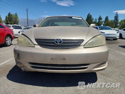 Piąte zdjęcie samochodu w środku: 2002 TOYOTA CAMRY LE VIN:JTDBE32K620099503 - miniatura