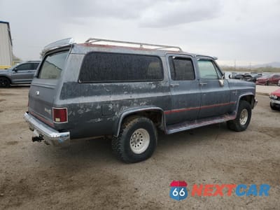 Trzecie zdjęcie samochodu z tyłu: 1987 CHEVROLET SUBURBAN V10 VIN:1GNEV16K5HF122312 - miniatura