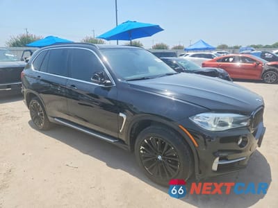 Czwarte zdjęcie samochodu z boku: 2014 BMW X5 SDRIVE35I VIN:5UXKR2C50E0C01634 - miniatura