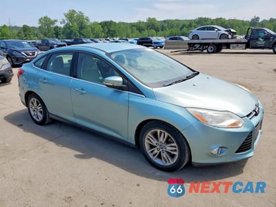 Czwarte zdjęcie samochodu z boku: 2012 FORD FOCUS SEL VIN:1FAHP3H24CL411027 - miniatura