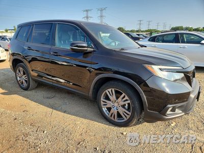 Czwarte zdjęcie samochodu z boku: 2020 HONDA PASSPORT EXL VIN:5FNYF8H53LB002153 - miniatura