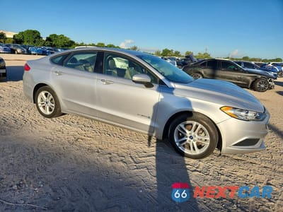 Czwarte zdjęcie samochodu z boku: 2018 FORD FUSION SE HYBRID VIN:3FA6P0LU1JR200896 - miniatura