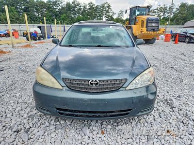 Piąte zdjęcie samochodu w środku: 2002 TOYOTA CAMRY LE VIN:4T1BE30K32U633676 - miniatura