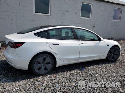 Trzecie zdjęcie samochodu z tyłu: 2021 TESLA MODEL 3 VIN:5YJ3E1EBXMF035604 - miniatura