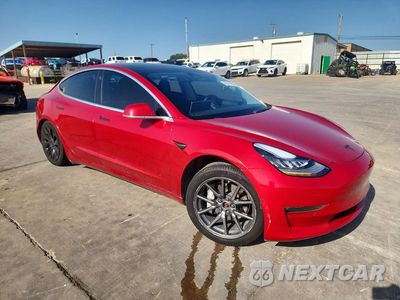Czwarte zdjęcie samochodu z boku: 2019 TESLA MODEL 3 VIN:5YJ3E1EB0KF442070 - miniatura
