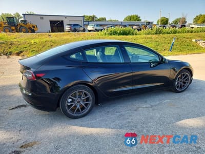 Trzecie zdjęcie samochodu z tyłu: 2023 TESLA MODEL 3 VIN:5YJ3E1EA1PF447969 - miniatura