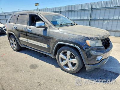 Czwarte zdjęcie samochodu z boku: 2013 JEEP GRAND CHEROKEE OVERLAND VIN:1C4RJFCT4DC525208 - miniatura