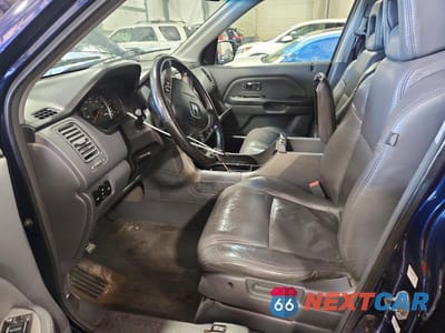 Zdjęcie 7 z 14 samochodu: 2004 HONDA PILOT EXL VIN:2HKYF18624H567464 - miniatura