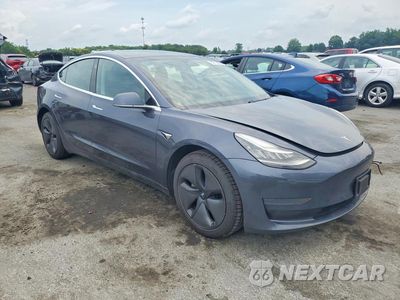 Czwarte zdjęcie samochodu z boku: 2019 TESLA MODEL 3 VIN:5YJ3E1EAXKF427017 - miniatura