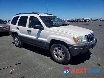 Czwarte zdjęcie samochodu z boku: 2000 JEEP GRAND CHEROKEE LAREDO VIN:1J4GW48S6YC114132 - miniatura