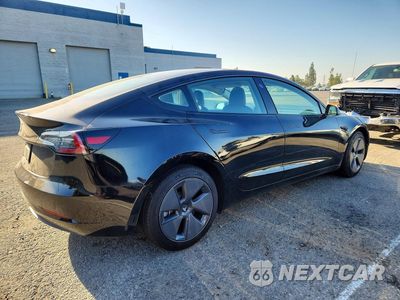 Trzecie zdjęcie samochodu z tyłu: 2023 TESLA MODEL 3 VIN:5YJ3E1EA1PF566721 - miniatura