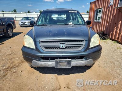 Piąte zdjęcie samochodu w środku: 2004 HONDA PILOT LX VIN:2HKYF18124H520844 - miniatura