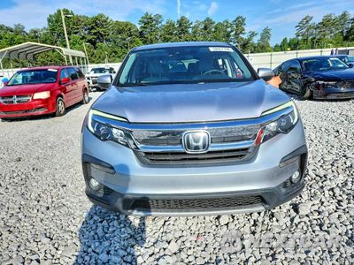 Piąte zdjęcie samochodu w środku: 2021 HONDA PILOT EX VIN:5FNYF5H3XMB014413 - miniatura