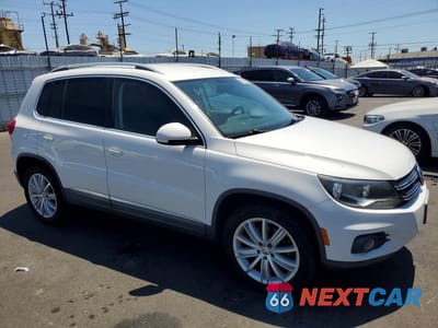 Czwarte zdjęcie samochodu z boku: 2012 VOLKSWAGEN TIGUAN S VIN:WVGAV7AX5CW606224 - miniatura