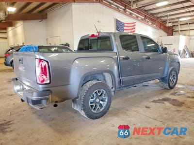 Trzecie zdjęcie samochodu z tyłu: 2021 GMC CANYON AT4 VIN:1GTG6FEN4M1106665 - miniatura