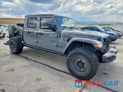 Czwarte zdjęcie samochodu z boku: 2022 JEEP GLADIATOR RUBICON VIN:1C6JJTBM4NL136275 - miniatura