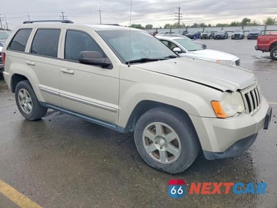 Czwarte zdjęcie samochodu z boku: 2010 JEEP GRAND CHEROKEE LAREDO VIN:1J4PR4GKXAC130753 - miniatura