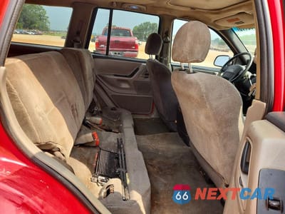 Zdjęcie 11 z 13 samochodu: 1999 JEEP GRAND CHEROKEE LAREDO VIN:1J4GW58S8XC588362 - miniatura