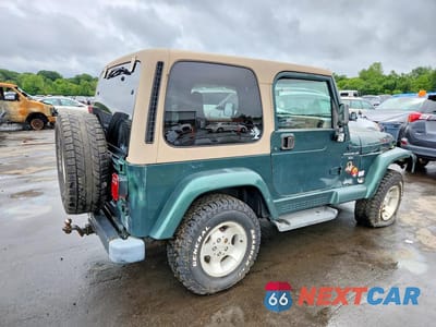 Trzecie zdjęcie samochodu z tyłu: 2000 JEEP WRANGLER / TJ SAHARA VIN:1J4FA59SXYP770552 - miniatura