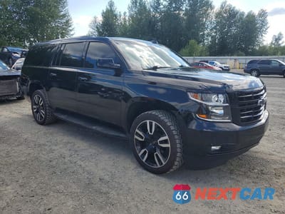 Czwarte zdjęcie samochodu z boku: 2019 CHEVROLET SUBURBAN C1500 LT VIN:1GNSCHKC5KR270546 - miniatura