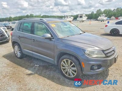 Czwarte zdjęcie samochodu z boku: 2012 VOLKSWAGEN TIGUAN S VIN:WVGAV7AX0CW003956 - miniatura