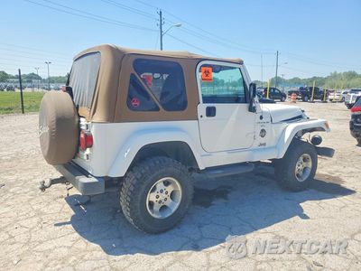 Trzecie zdjęcie samochodu z tyłu: 2000 JEEP WRANGLER / TJ SAHARA VIN:1J4FA59S0YP773850 - miniatura